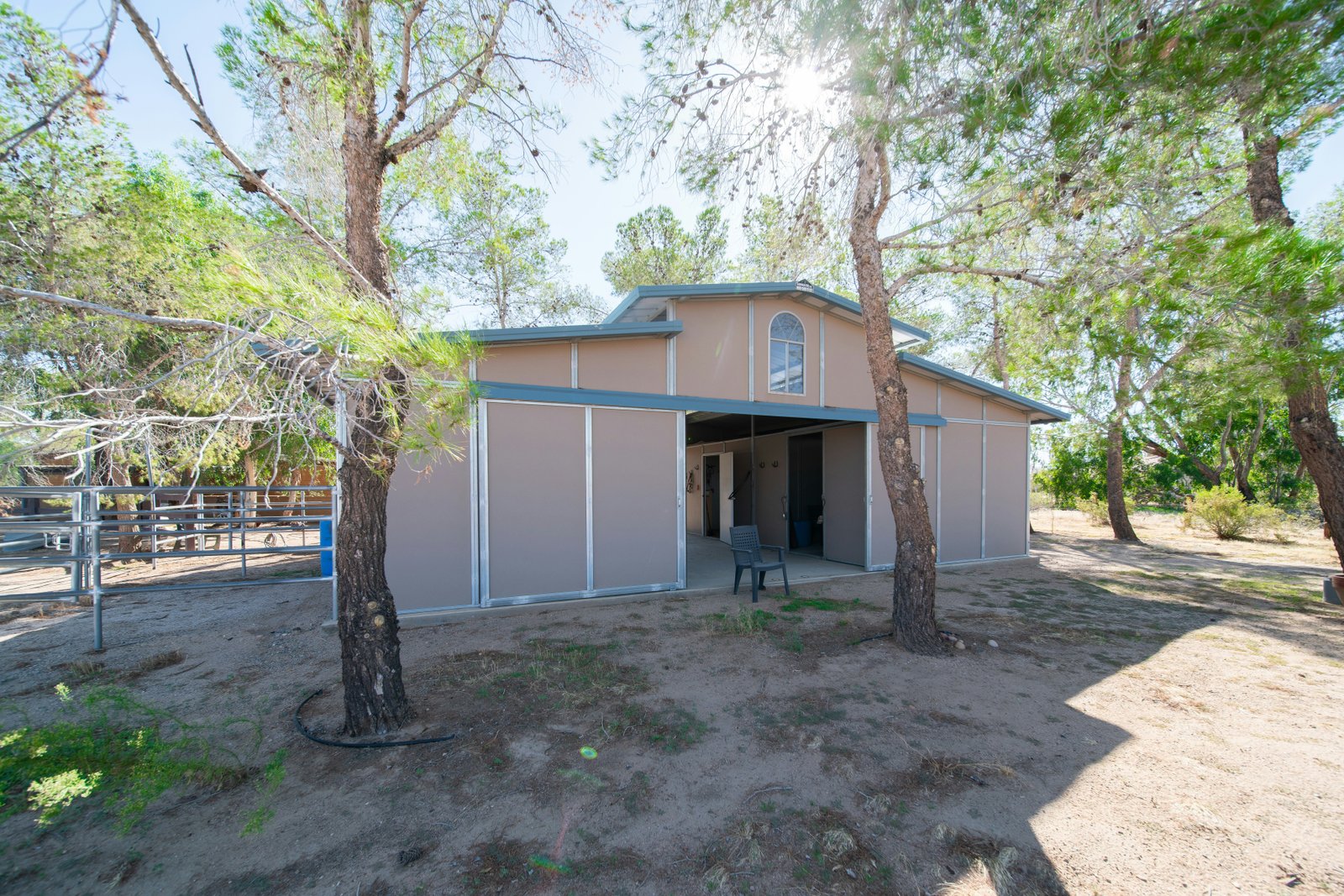 A metal structure on dirt.